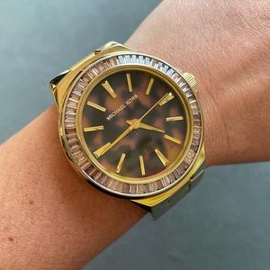 Michael Kors gold and tortoise shell watch.